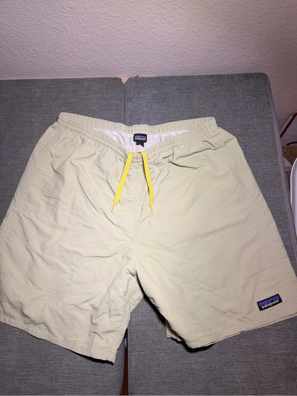 Patagonia Men's Light Beige Swim Trunks with Yellow Drawcord